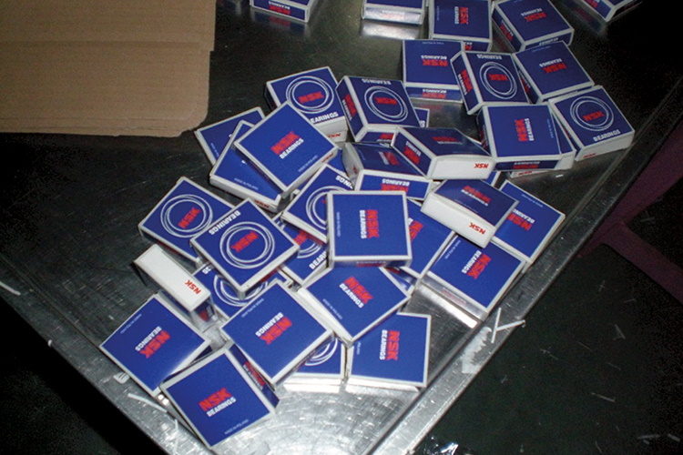 Fake NSK bearings in their packaging found at the production facility of a counterfeiter